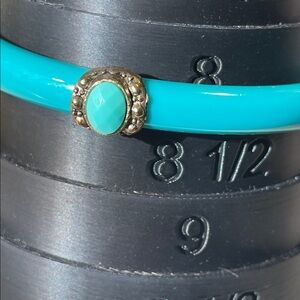 Turquoise Blue Acrylic Bangle With 4 Framed Faceted Cabochons - measures an 8